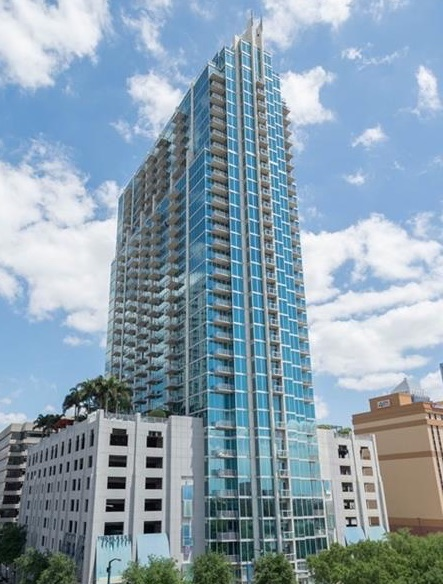 Tampa Condo Insurance Appraisal Inspection | FPAT - FPAT - FPAT Fpat Licensed Appraiser Conducting a Detailed Insurance Appraisal Inspection on a Tampa Condominium Balcony Overlooking the Bay