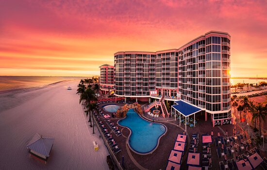 Florida Condo Compliance: Insurance Appraisals & Reserve Studies in Fort Myers - FPAT - FPAT Aerial View of a Luxury Fort Myers Beachfront Condominium at Sunset Highlighting Structural Elements Requiring a Structural Integrity Reserve Study Sirs
